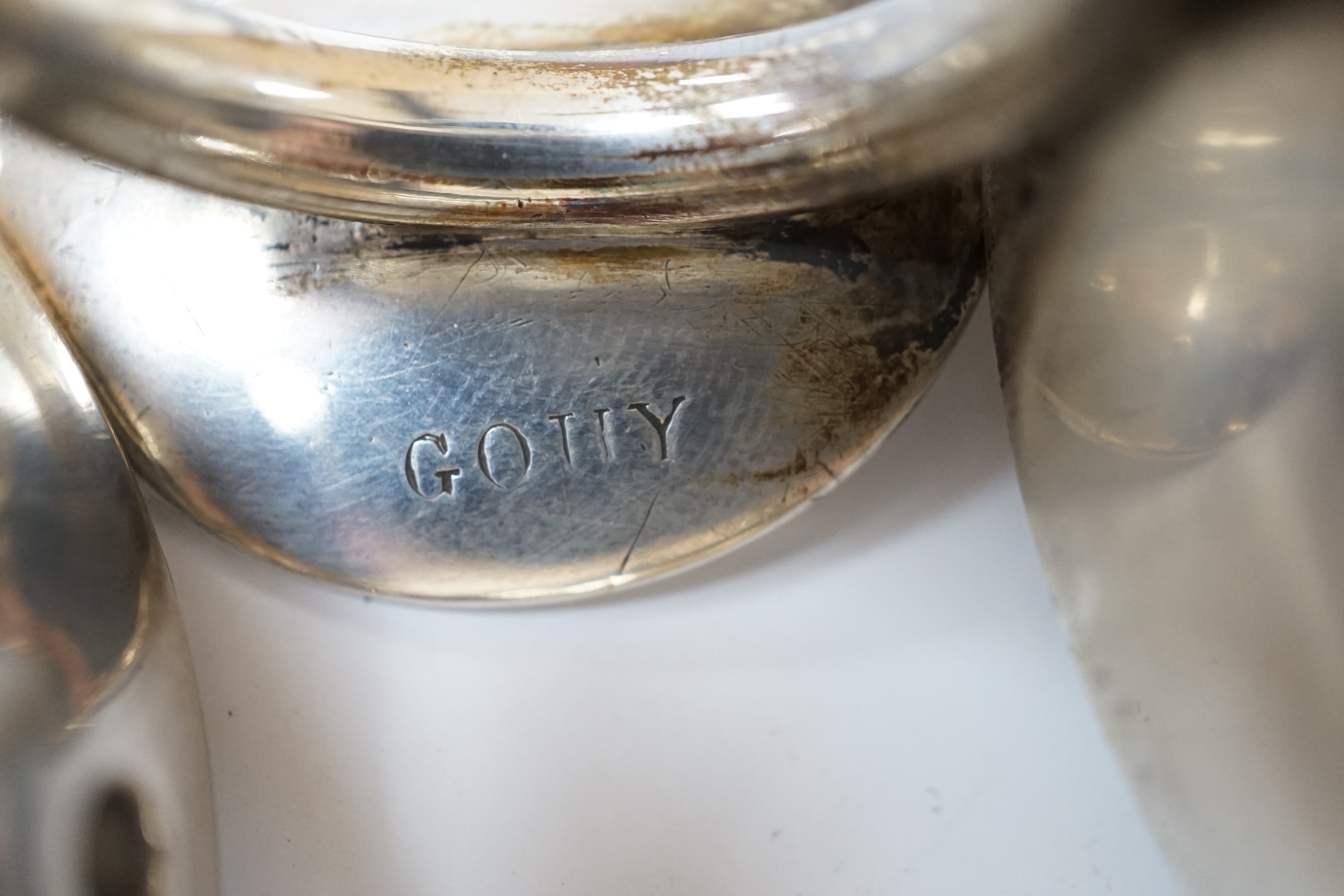 Three assorted late 19th/early 20th century French white metal taste vin, largest 11.1cm over handle.